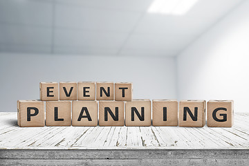 Image showing Event planning sign on a wooden desk in an office