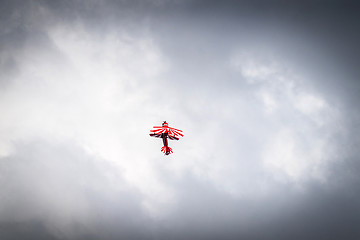 Image showing Airplane flying up in cloudy weather