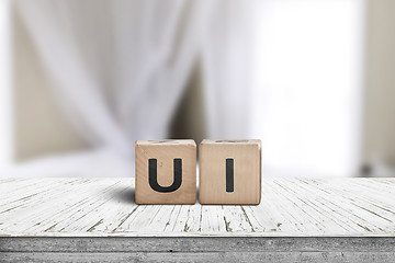Image showing UI development sign on a desk in a room