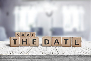 Image showing Save the date memo sign on a wooden table