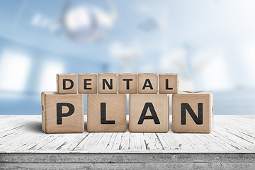 Image showing Dental plan sign with a blue room in the background