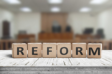 Image showing Reform sign on a desk with a blurry background