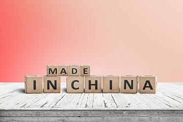 Image showing Made in China sign on a wooden desk