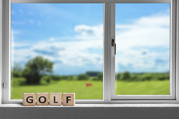 Image showing Golf sign in a window with a view to a golf course