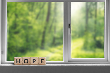 Image showing Hope sign in a window sill with a view