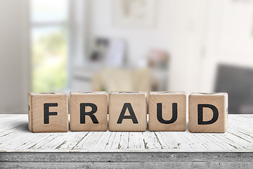 Image showing Fraud sign made of wooden blocks on a white desk