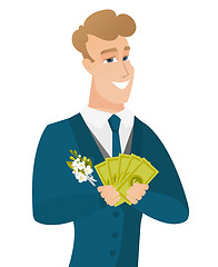 Image showing Young caucasian groom holding money.