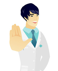 Image showing Young asian doctor showing palm hand.
