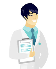 Image showing Asian doctor holding clipboard with documents.