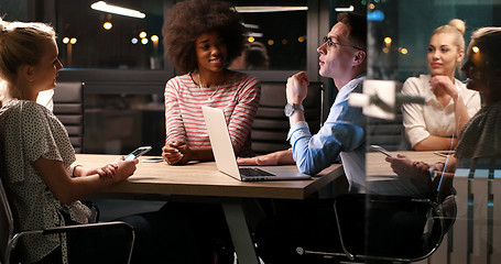 Image showing Multiethnic startup business team in night office