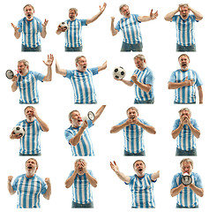 Image showing The Argentinean soccer fan celebrating on white background