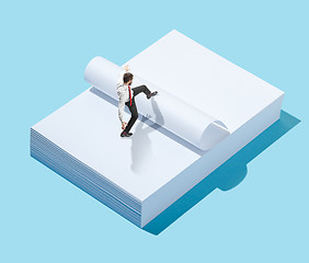 Image showing Flat isometric view of businessman going at blank sheets of paper with empty copy space