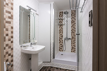 Image showing The interior of a small bathroom with shower