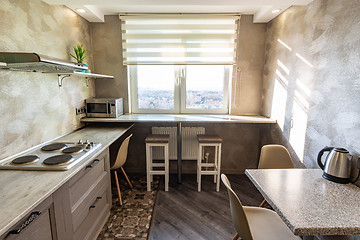 Image showing The interior of a small dining room in the hostel