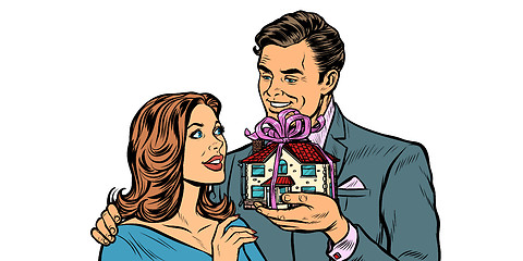 Image showing Husband and wife. House as a gift isolate on white background