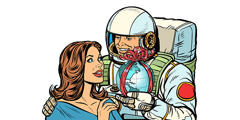 Image showing Couple in love. Astronaut gives a woman the Earth isolate on white background