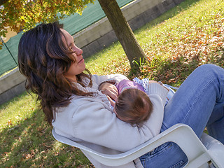 Image showing Woman breastfeeding baby