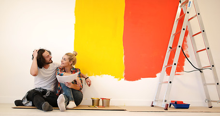 Image showing Happy young couple relaxing after painting