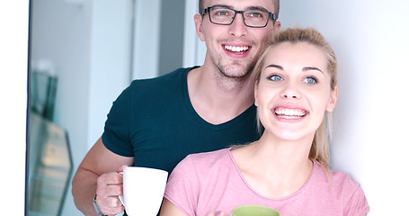 Image showing young couple enjoying morning coffee