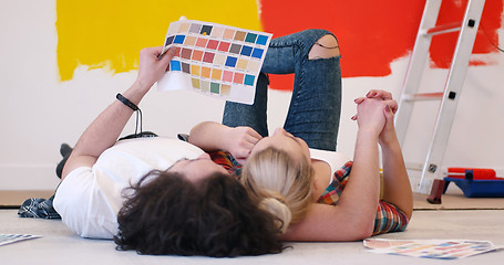 Image showing Happy young couple relaxing after painting