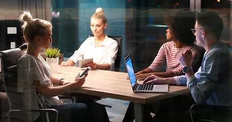 Image showing Multiethnic startup business team in night office