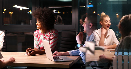 Image showing Multiethnic startup business team in night office