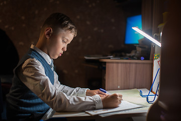 Image showing pupil boy does his homework