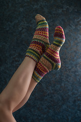 Image showing Woman legs in wool knitted socks