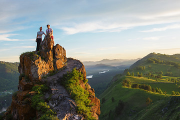 Image showing Happy man and woman on top mountain