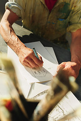 Image showing Close up man working of Architect sketching a construction project on his plane project at site construction work