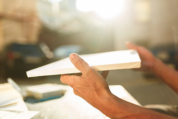 Image showing Close up man working of Architect sketching a construction project on his plane project at site construction work