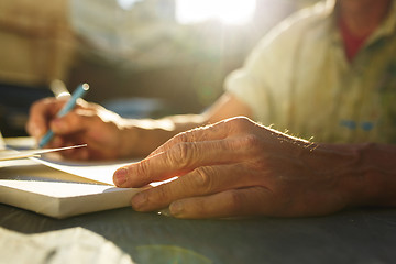 Image showing Close up man working of Architect sketching a construction project on his plane project at site construction work