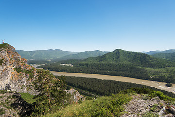 Image showing Man standing on top of cliff