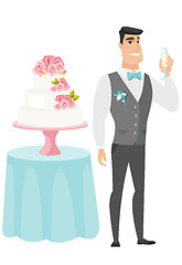 Image showing Groom standing near cake with glass of champagne.