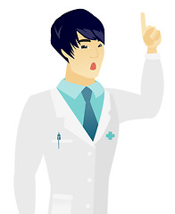 Image showing Asian doctor with open mouth pointing finger up.