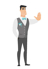 Image showing Caucasian groom showing stop hand gesture.