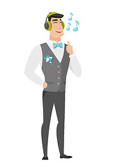 Image showing Groom listening to music in headphones.