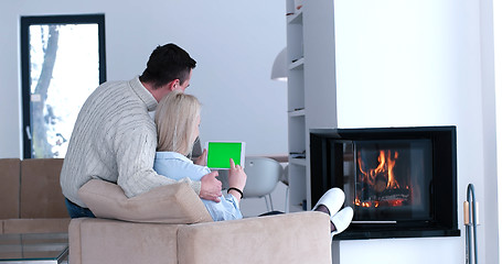 Image showing couple relaxing at  home with tablet computers