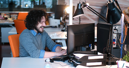 Image showing businessman working using a computer in startup office