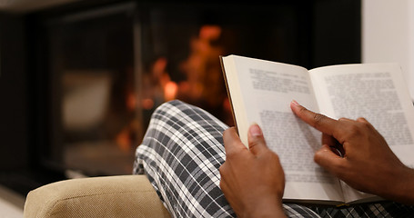 Image showing black woman at home reading book