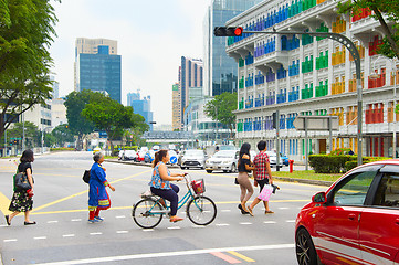 Image showing People crossing a road. Singapore