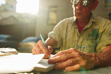 Image showing Close up man working of Architect sketching a construction project on his plane project at site construction work