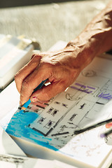 Image showing Close up man working of Architect sketching a construction project on his plane project at site construction work