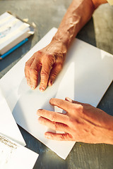 Image showing Close up man working of Architect sketching a construction project on his plane project at site construction work