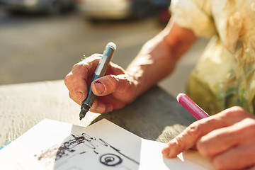 Image showing Close up man working of Architect sketching a construction project on his plane project at site construction work