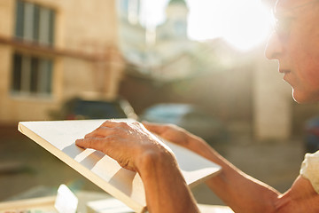 Image showing Close up man working of Architect sketching a construction project on his plane project at site construction work