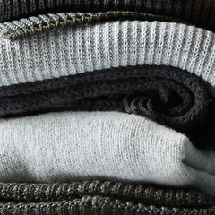 Image showing Pile of knitted winter clothes on background