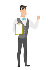 Image showing Groom with clipboard giving thumb up.