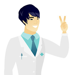 Image showing Young asian doctor showing the victory gesture.