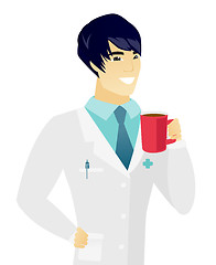 Image showing Young asian doctor holding cup of coffee.